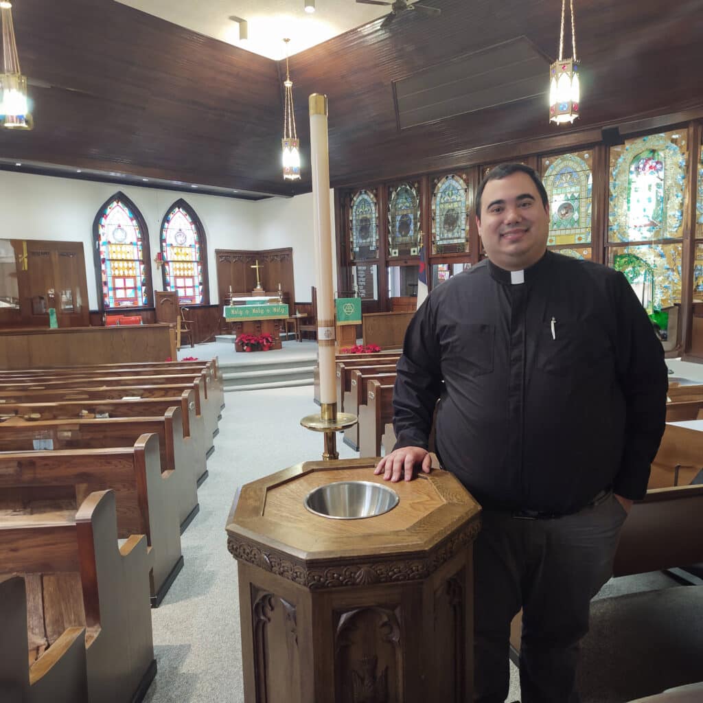 Vatalare at the baptismal font of Christ Rupp Lutheran Church, one of five NALC congregations that form RLCM.